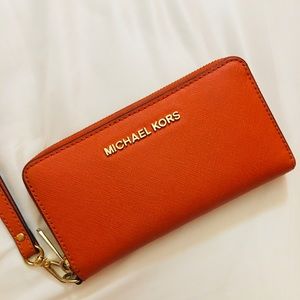 michael kors orange wristlet